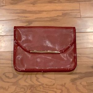 Red clutch with braided optional strap. NWT!